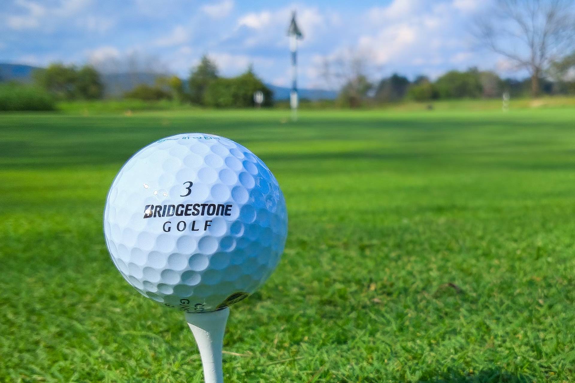 A white Bridgestone Golf branded golf ball