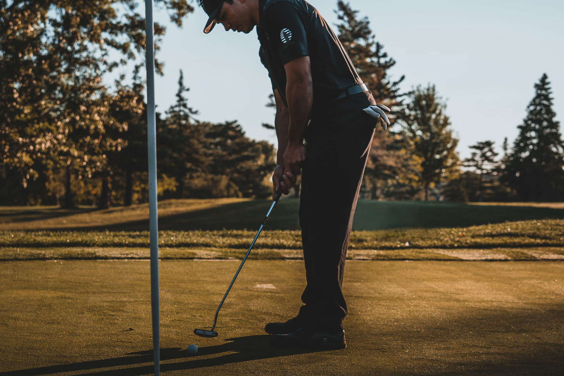 A man taking a putt