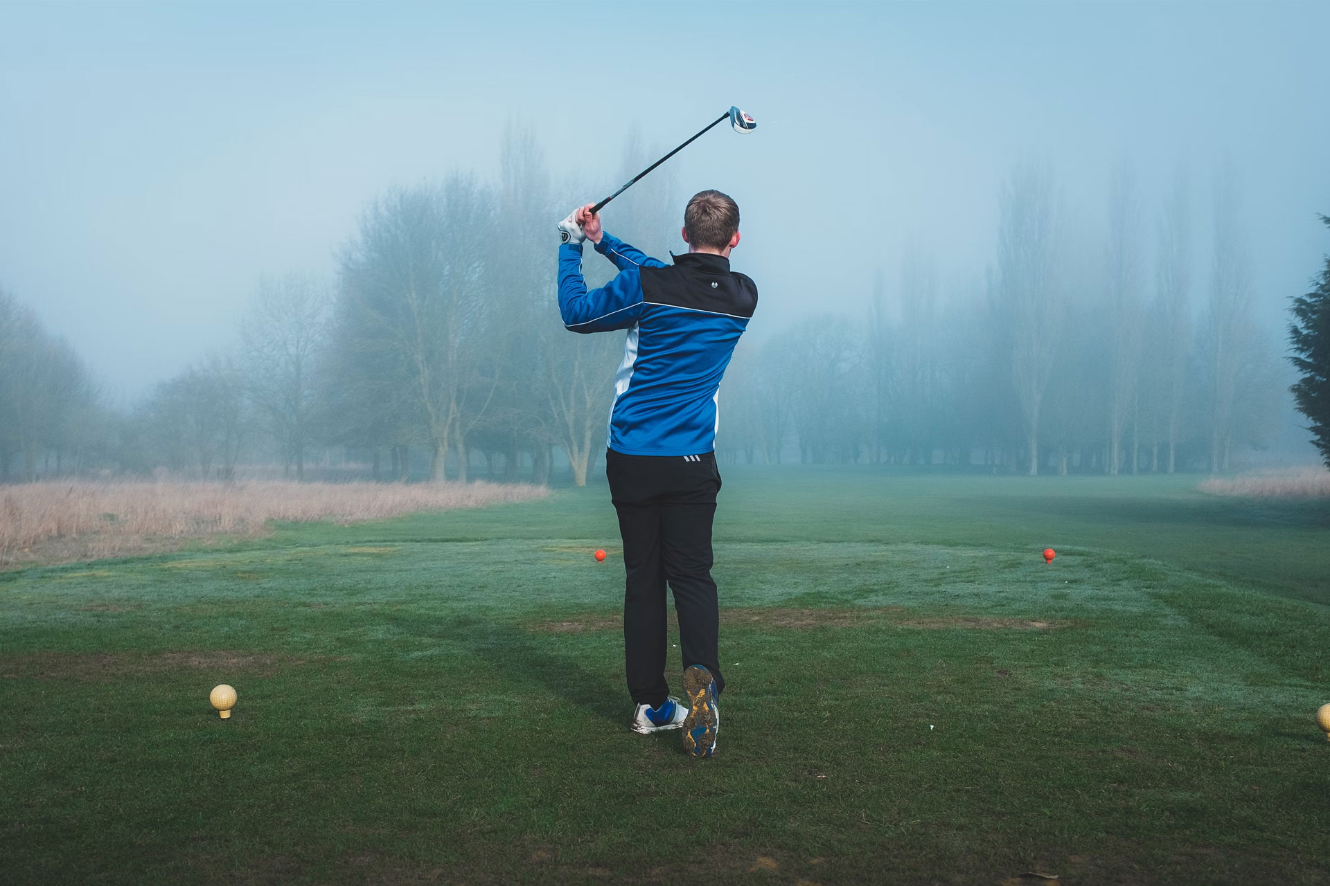 A young man taking a shot into the distance