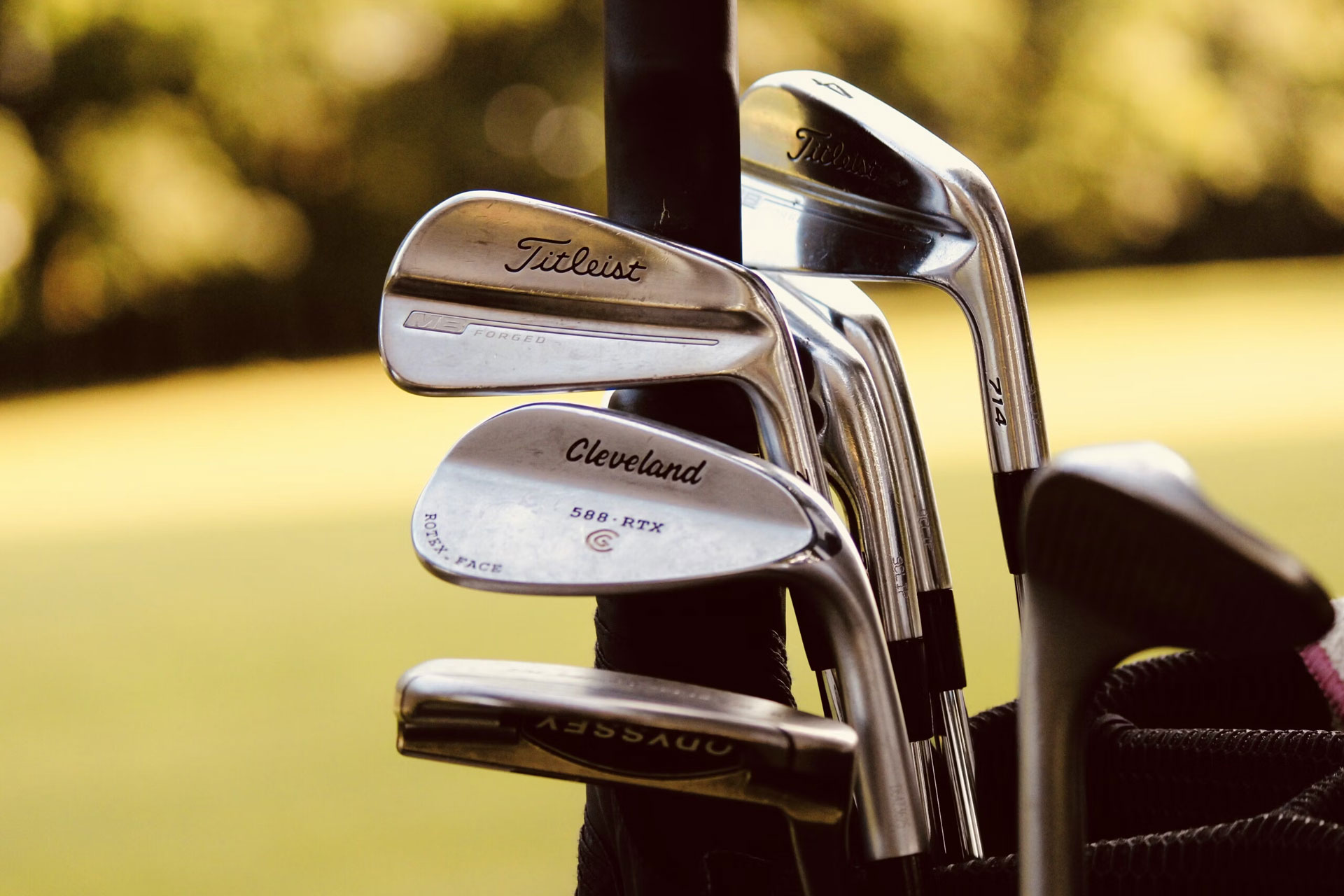 Gold clubs in a golf bag