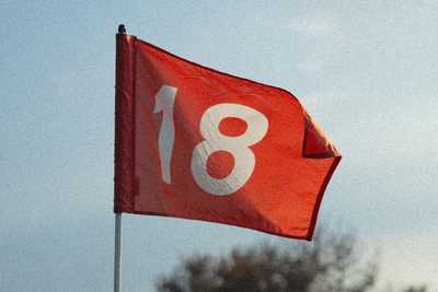 The flag for the 18th hole on a golf course