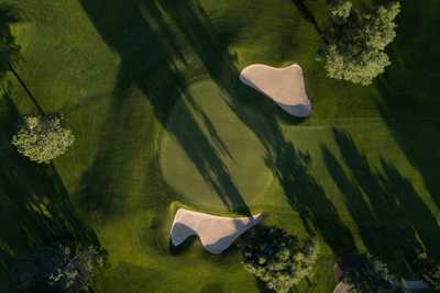 A birds-eye view of a sunny golf course